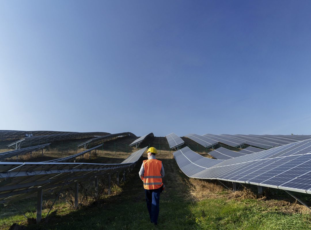person-near-alternative-energy-plant